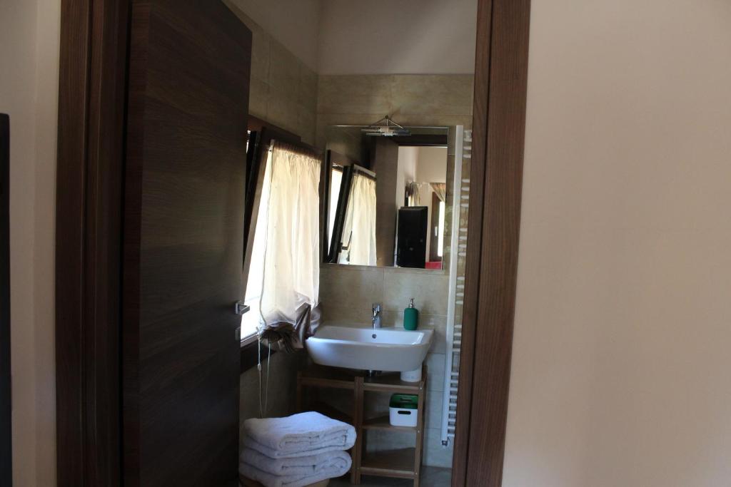 Koupelna v ubytování Archi Rooms