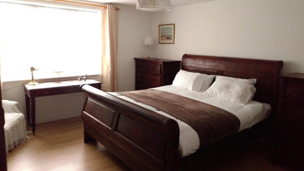 a bedroom with a large bed and a sink at Beach Road in Margate