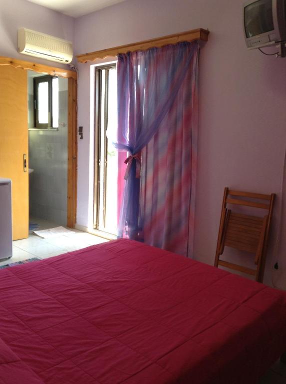 A bed or beds in a room at Noufaro studios