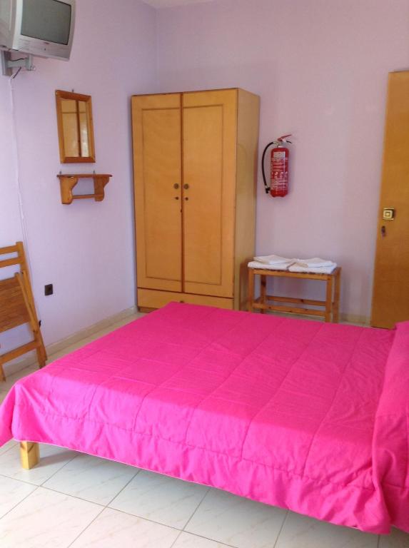A bed or beds in a room at Noufaro studios