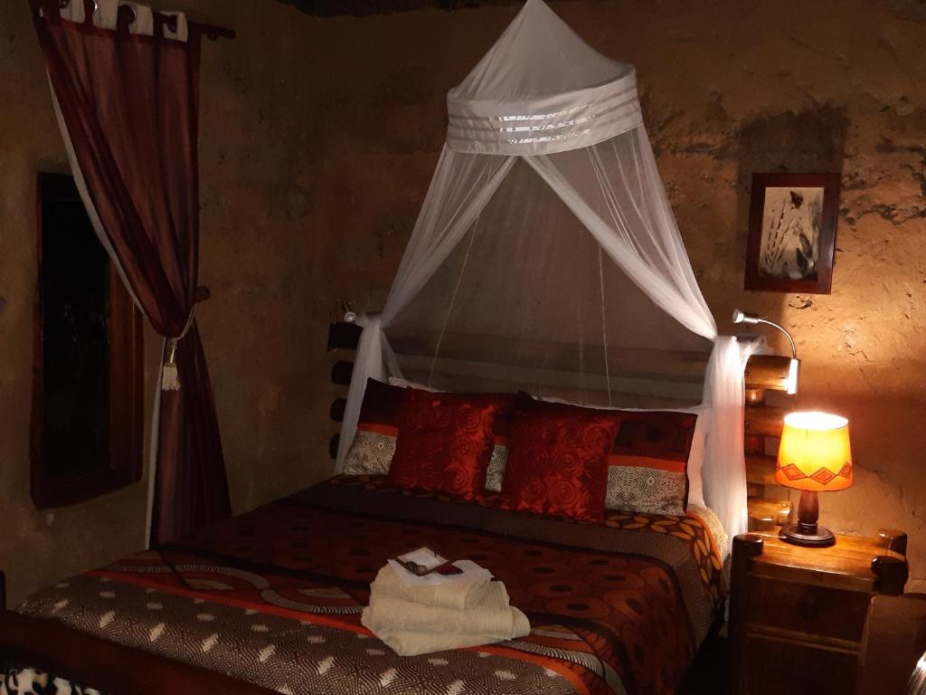 Ein Bett oder Betten in einem Zimmer der Unterkunft Five Pebbles on Piece of Africa