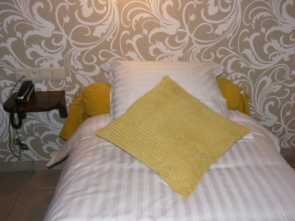 Postel nebo postele na pokoji v ubytování Hotel Van Reeth's Koffiebranderij