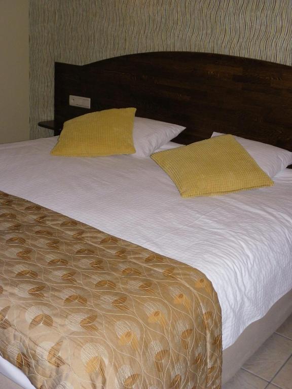 Postel nebo postele na pokoji v ubytování Hotel Van Reeth's Koffiebranderij