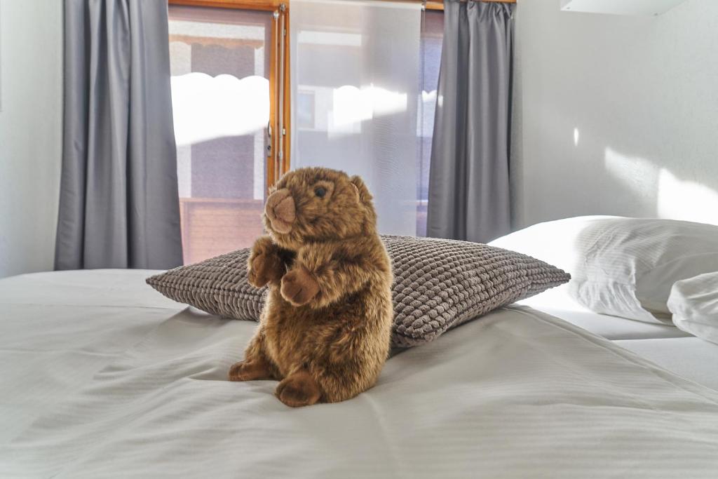 Postel nebo postele na pokoji v ubytování Hotel Marmotte