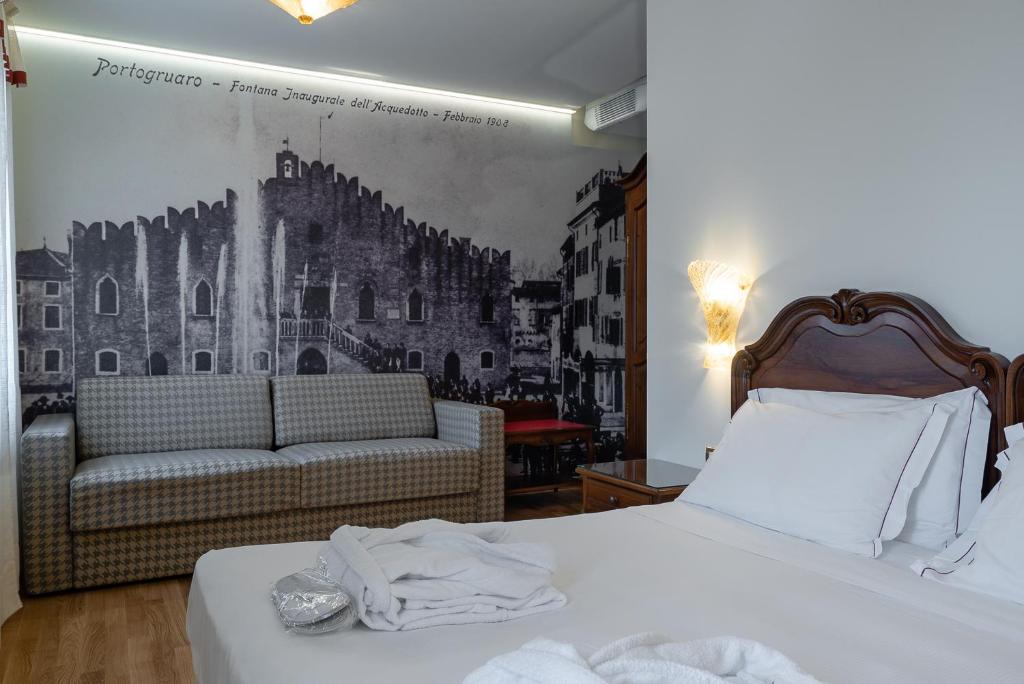 Postel nebo postele na pokoji v ubytování Hotel Spessotto