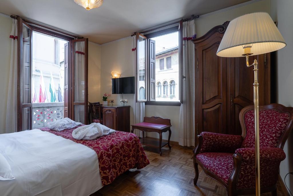 Postel nebo postele na pokoji v ubytování Hotel Spessotto