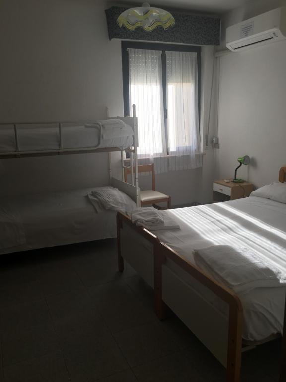 Postel nebo postele na pokoji v ubytování Hotel Alb's