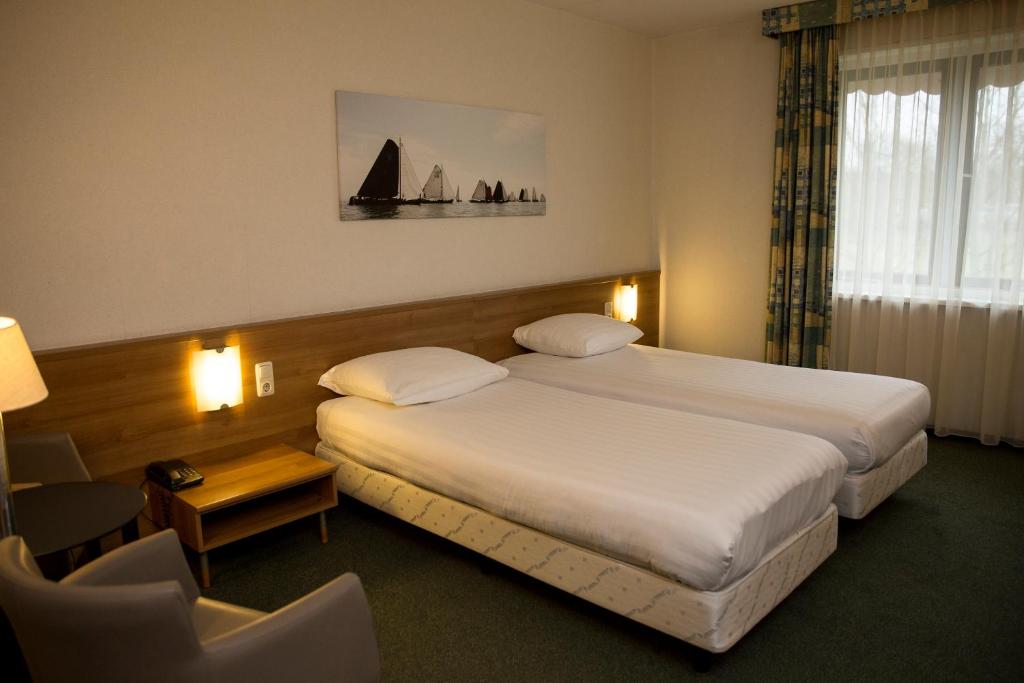 Postel nebo postele na pokoji v ubytování Fletcher Hotel Restaurant Heidehof