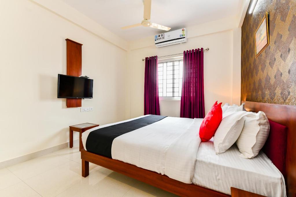 Postel nebo postele na pokoji v ubytování Hotel Hilite Inn