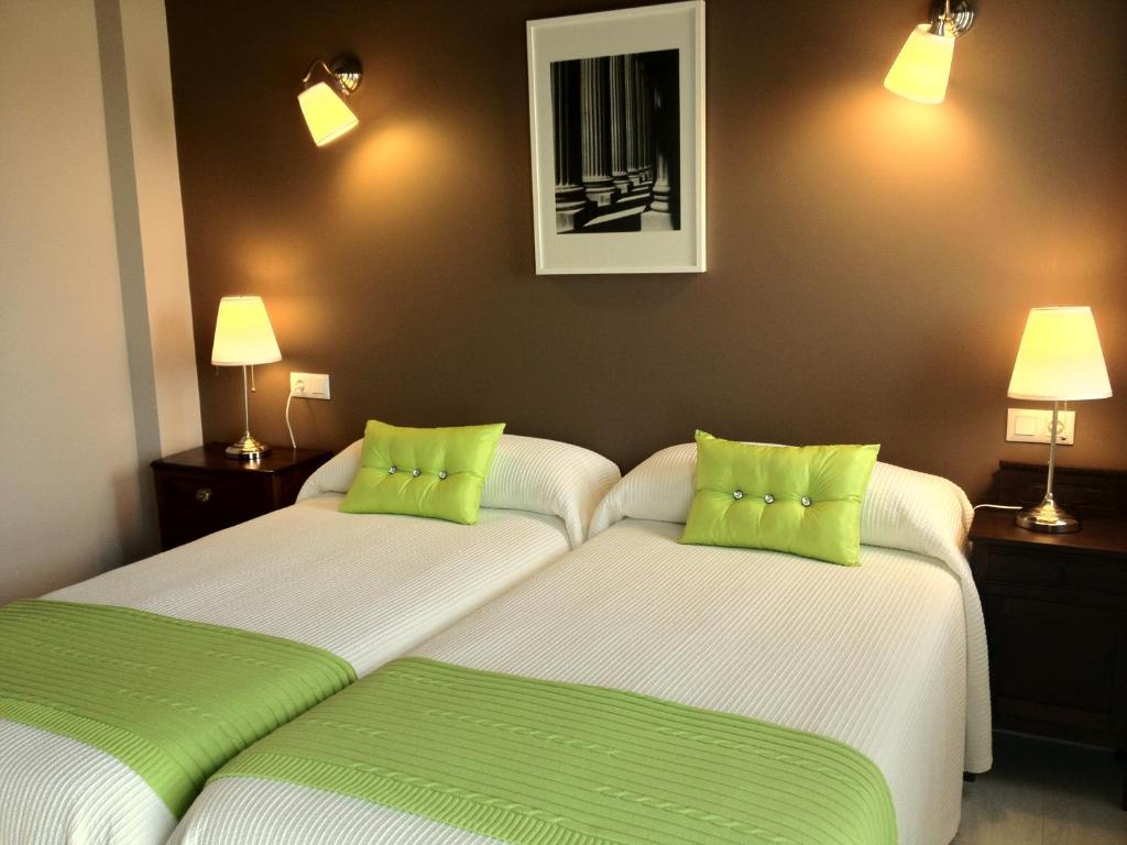 Postel nebo postele na pokoji v ubytování Apartamentos El Hospital de Villahormes