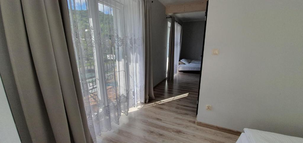 Postel nebo postele na pokoji v ubytování Apartamenty pod Czyrną