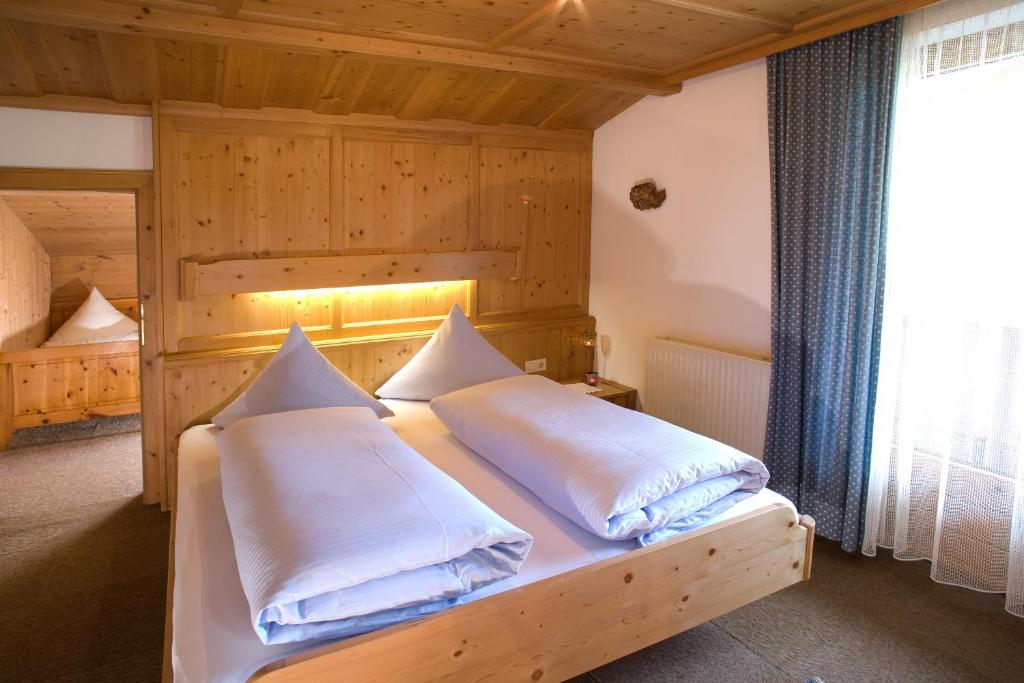 Postel nebo postele na pokoji v ubytování Gästehaus Rauch