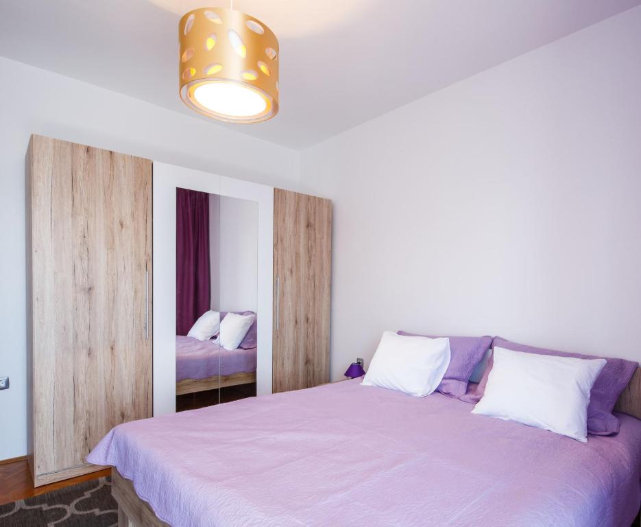 Posteľ alebo postele v izbe v ubytovaní APARTMAN VIDA