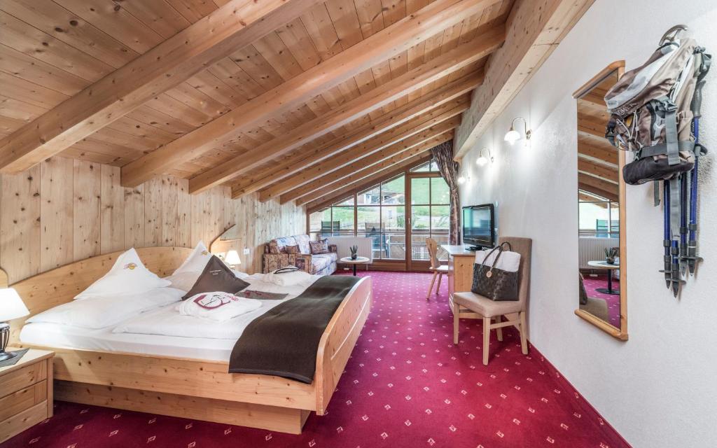 Postel nebo postele na pokoji v ubytování Panorama Resort Taljörgele
