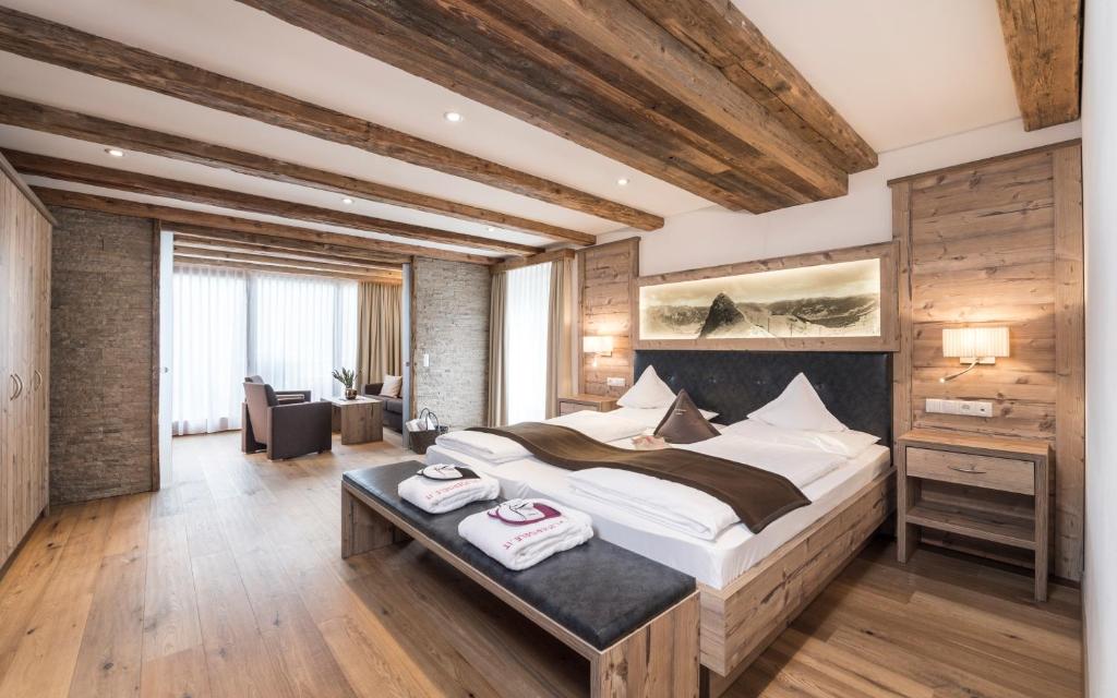 Postel nebo postele na pokoji v ubytování Panorama Resort Taljörgele