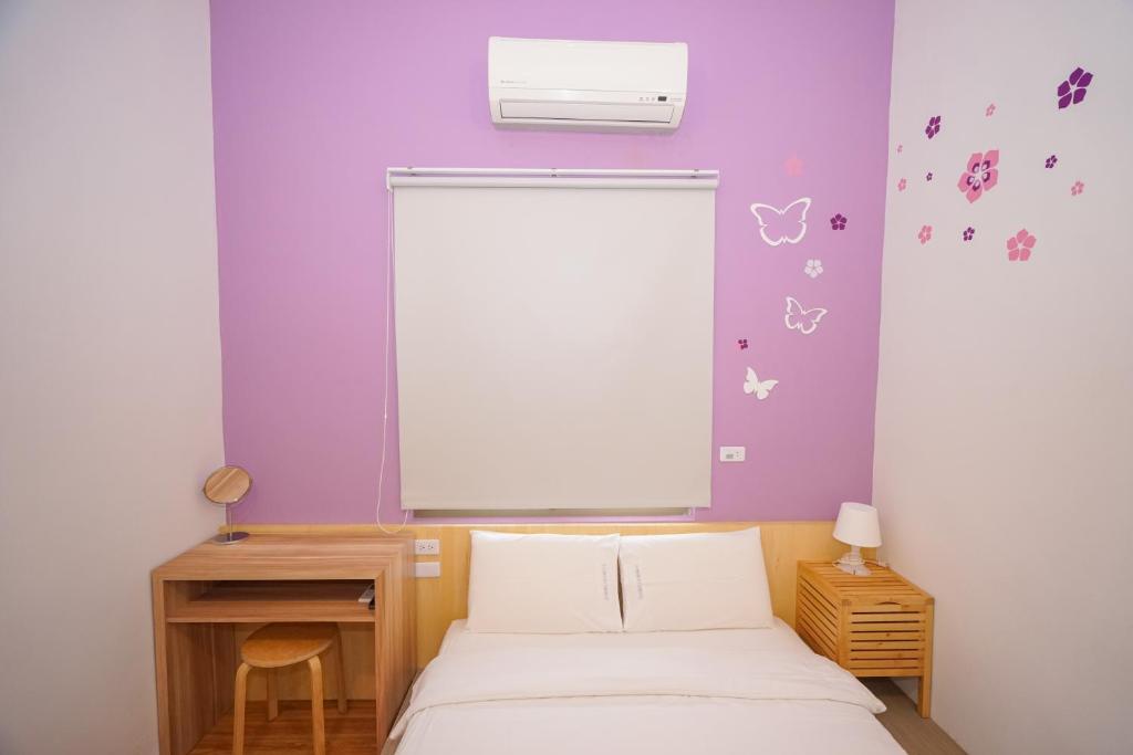 Postel nebo postele na pokoji v ubytování Colorful B&B