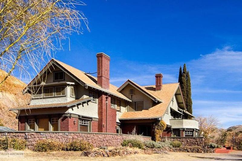 a large brick house with two chimneys on top at Greenway Manor in Bisbee