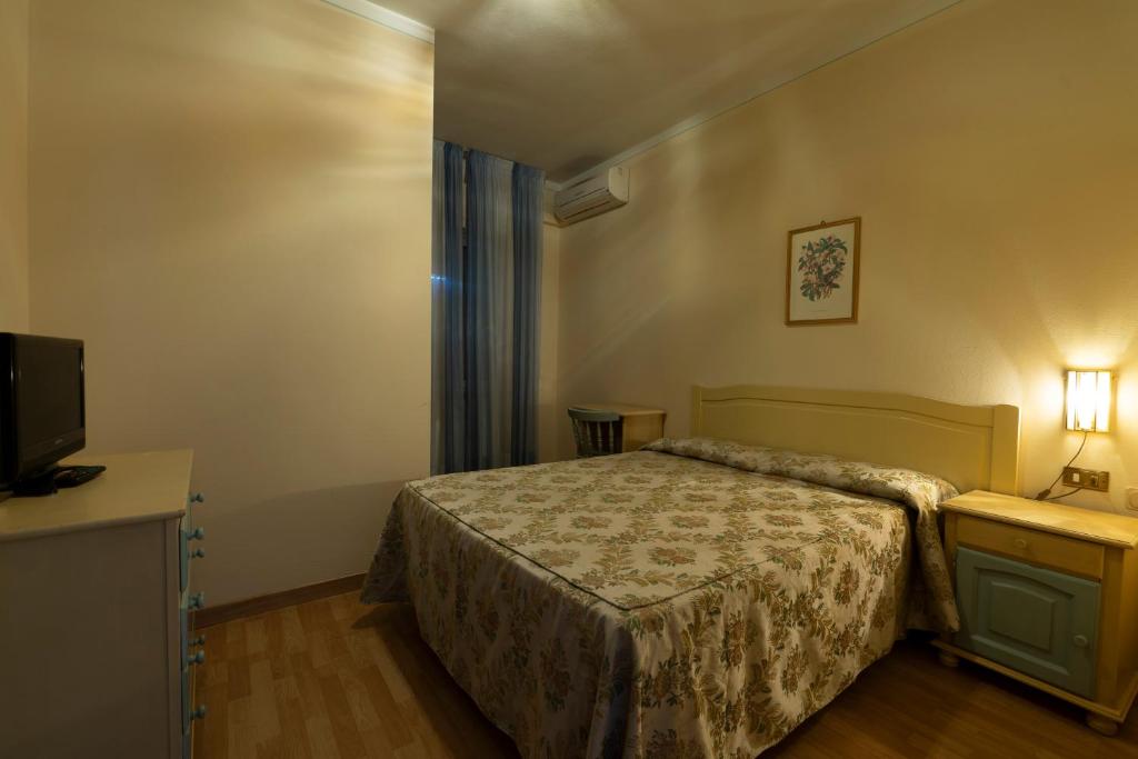 Postel nebo postele na pokoji v ubytování Hotel Mediavalle