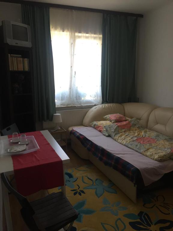 Postel nebo postele na pokoji v ubytování Apartman-Donau Tát