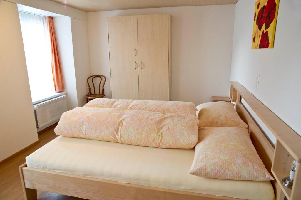 Ein Bett oder Betten in einem Zimmer der Unterkunft Hotel Alpina