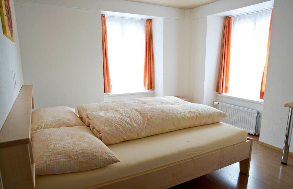 Ein Bett oder Betten in einem Zimmer der Unterkunft Hotel Alpina