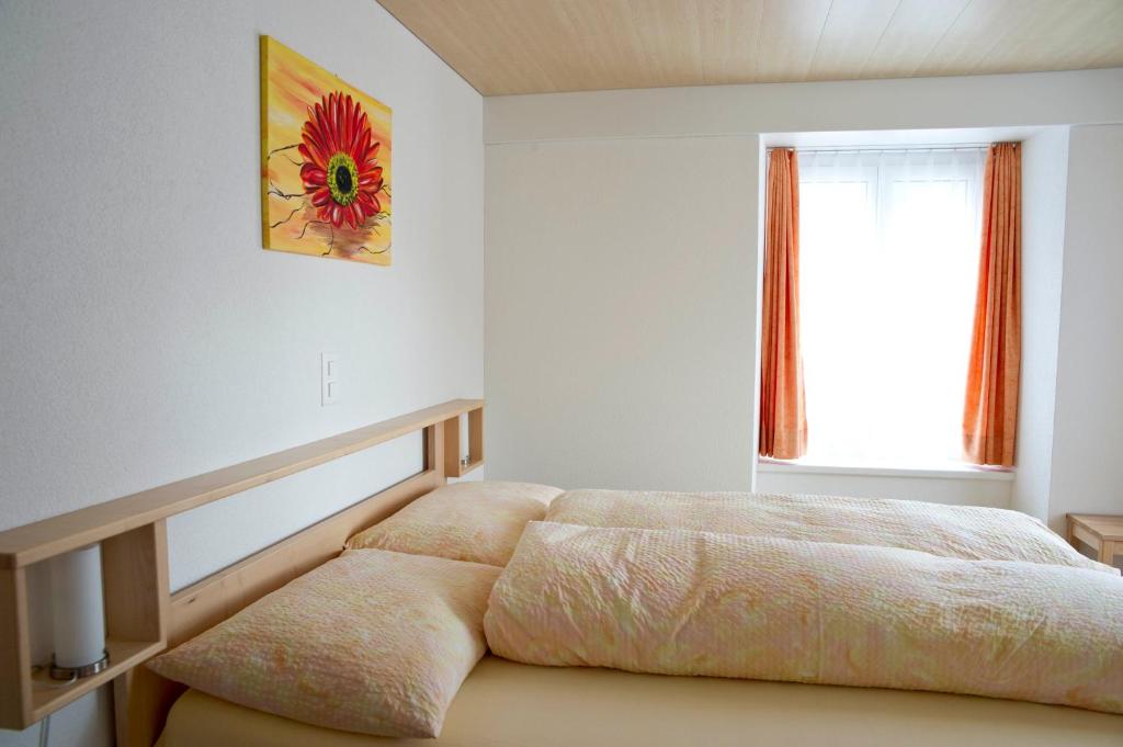 Ein Bett oder Betten in einem Zimmer der Unterkunft Hotel Alpina