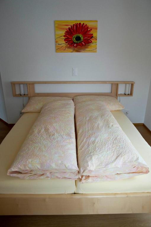 Ein Bett oder Betten in einem Zimmer der Unterkunft Hotel Alpina