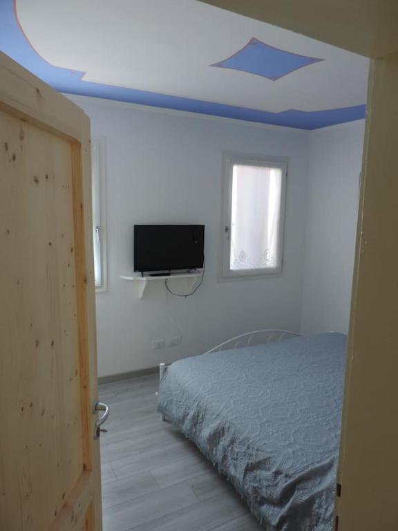 A bed or beds in a room at Casa Rossa
