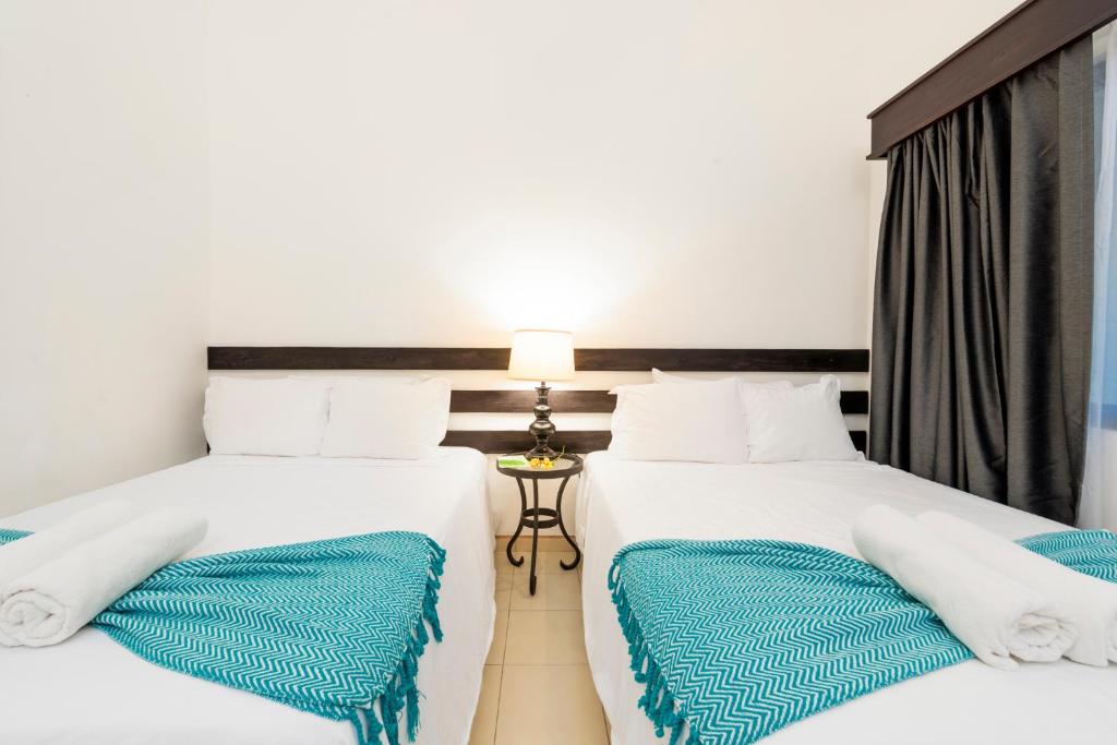 Postel nebo postele na pokoji v ubytování Seis Playas Hotel