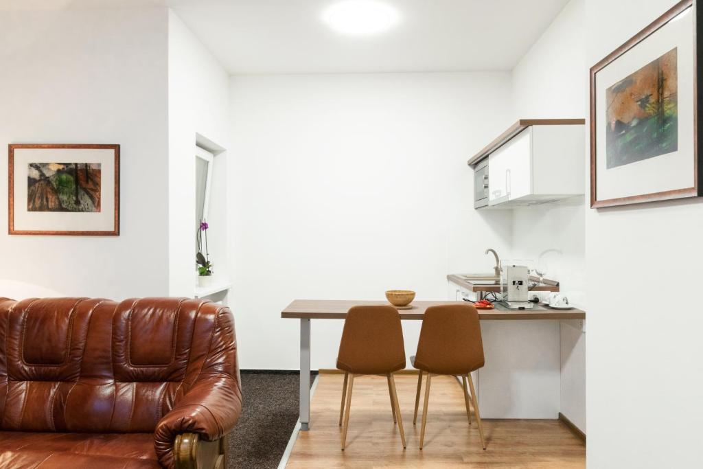 Posezení v ubytování VILLA CENTRUM APARTMÁNY s RAŇAJKAMI A SAUNOU