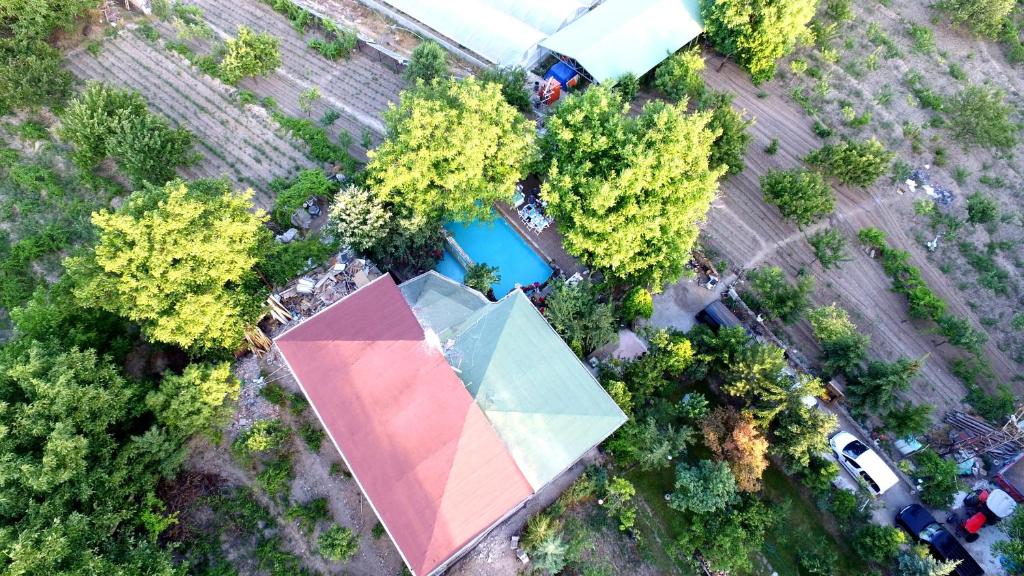an overhead view of a park with trees and a building at Kapadokya Organik Ciftlik Evi in Avanos