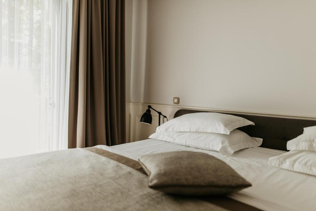 Posteľ alebo postele v izbe v ubytovaní Hotel Majestic