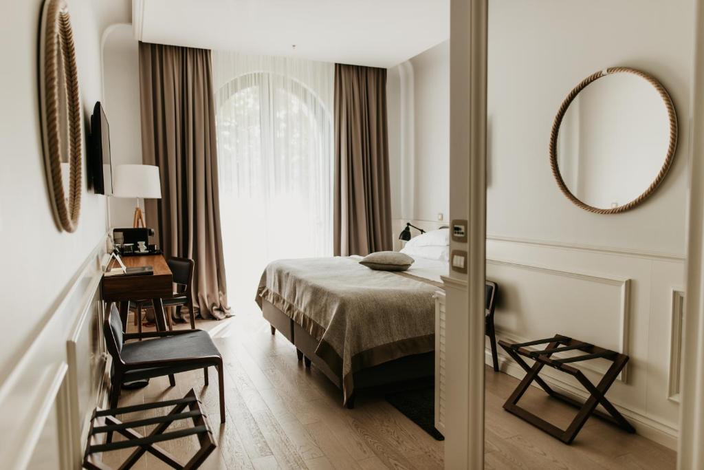 Posteľ alebo postele v izbe v ubytovaní Hotel Majestic