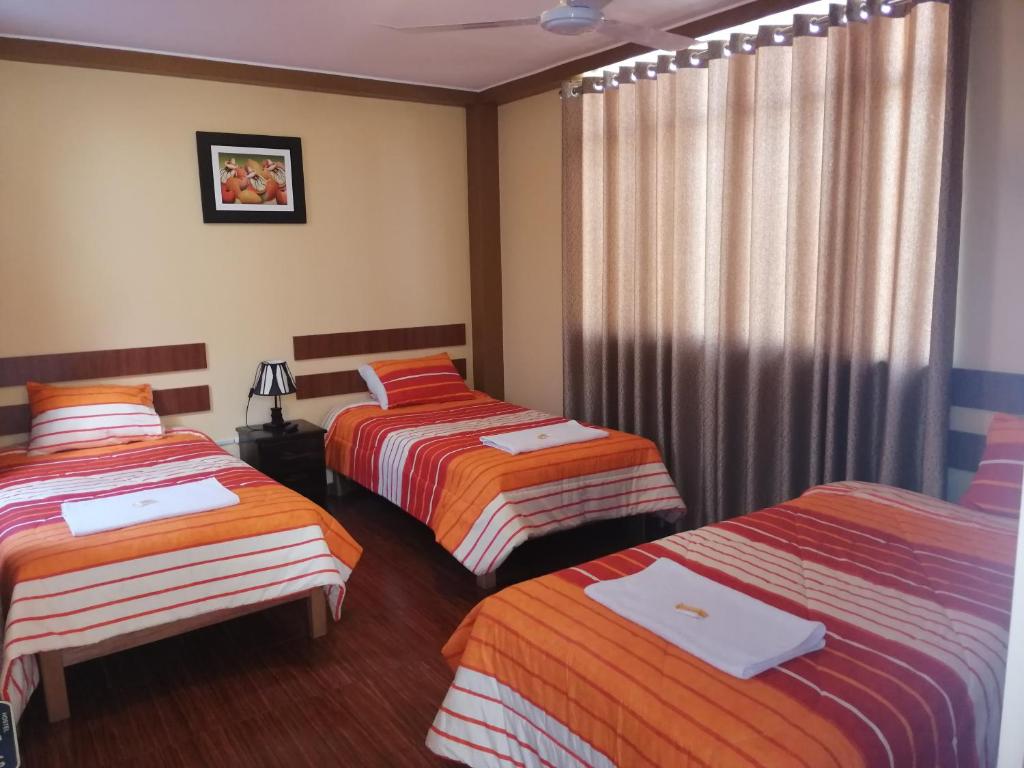 Postel nebo postele na pokoji v ubytování Nasca Travel One Hostel