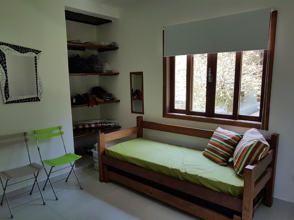 Cama ou camas em um quarto em Casa da Josie em Maresias com piscina no pé da Mata Atlântica - 4 quartos