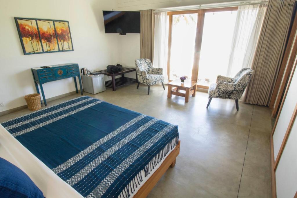 Postel nebo postele na pokoji v ubytování Ubuntu Beach Villas by Reveal