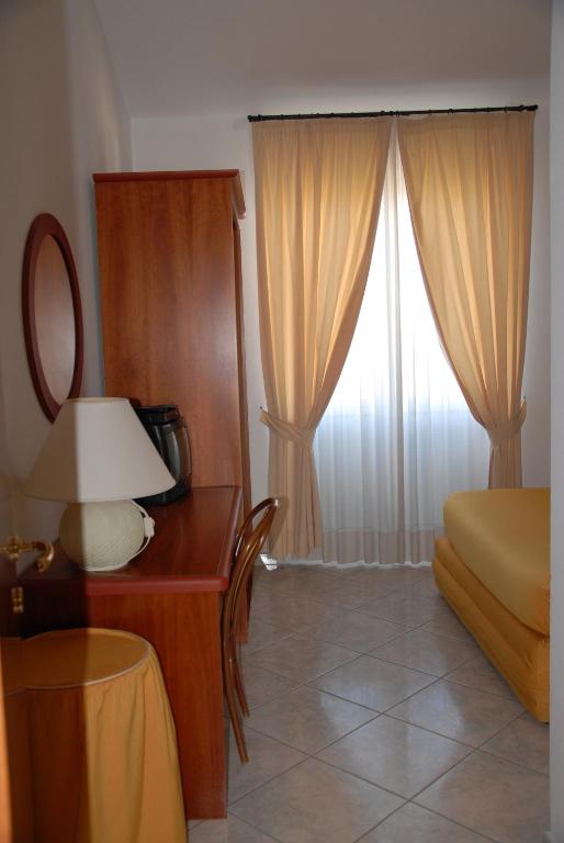 A bed or beds in a room at Il Cinghialetto