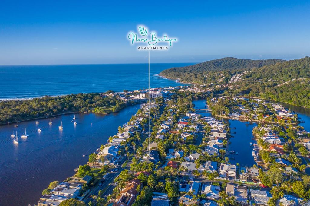 an aerial view of a harbor with boats at Noosa Boutique Apartments & Elkhorn Villas in Noosa Heads