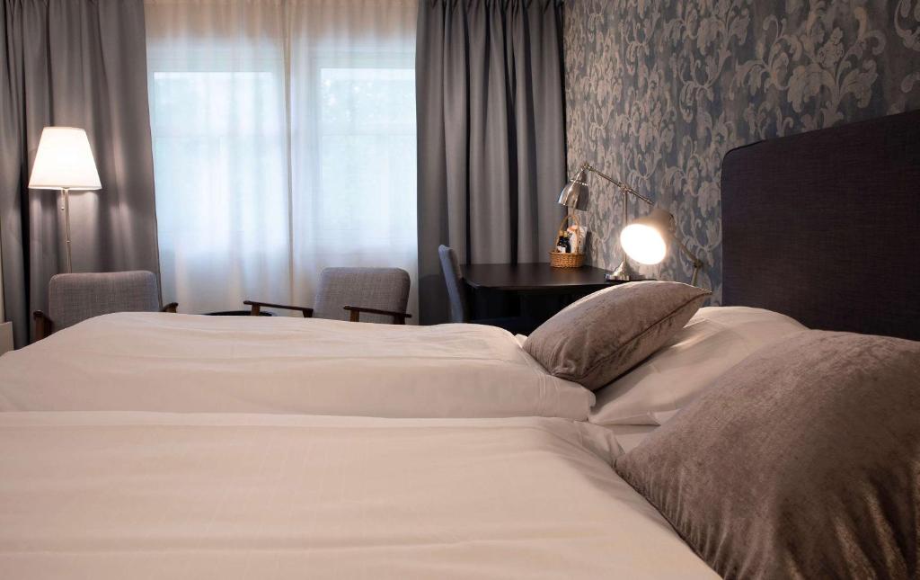 Postel nebo postele na pokoji v ubytování Best Western Tingvold Park Hotel
