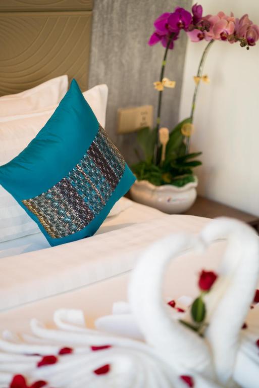 Postel nebo postele na pokoji v ubytování Orussey One Boutique