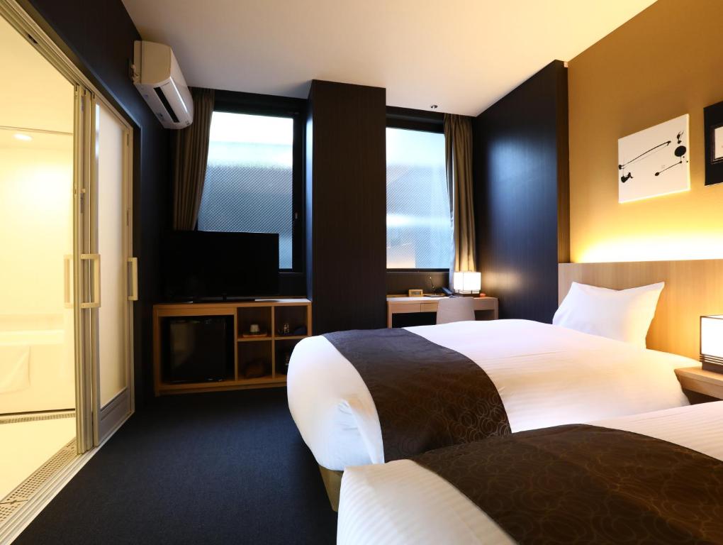 Postel nebo postele na pokoji v ubytování Hotel Wing International Kyoto - Shijo Karasuma