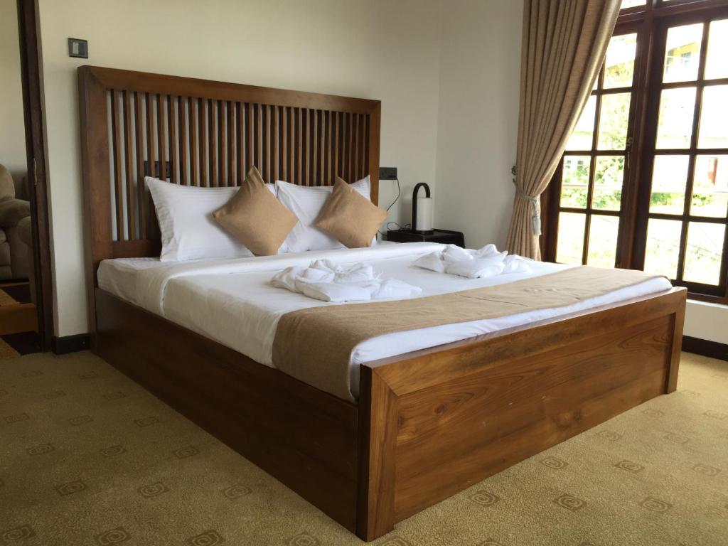 Marigold Home tesisinde bir odada yatak veya yataklar