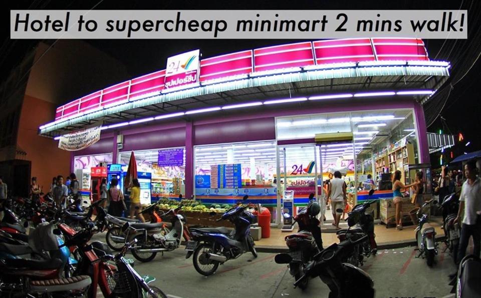 a group of motorcycles parked in front of a store at Lemonade Phuket Hotel -SHA Plus in Chalong