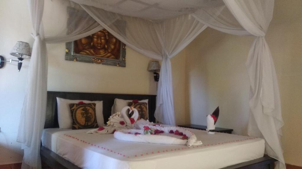 Postel nebo postele na pokoji v ubytování Ode Resto Guesthouse