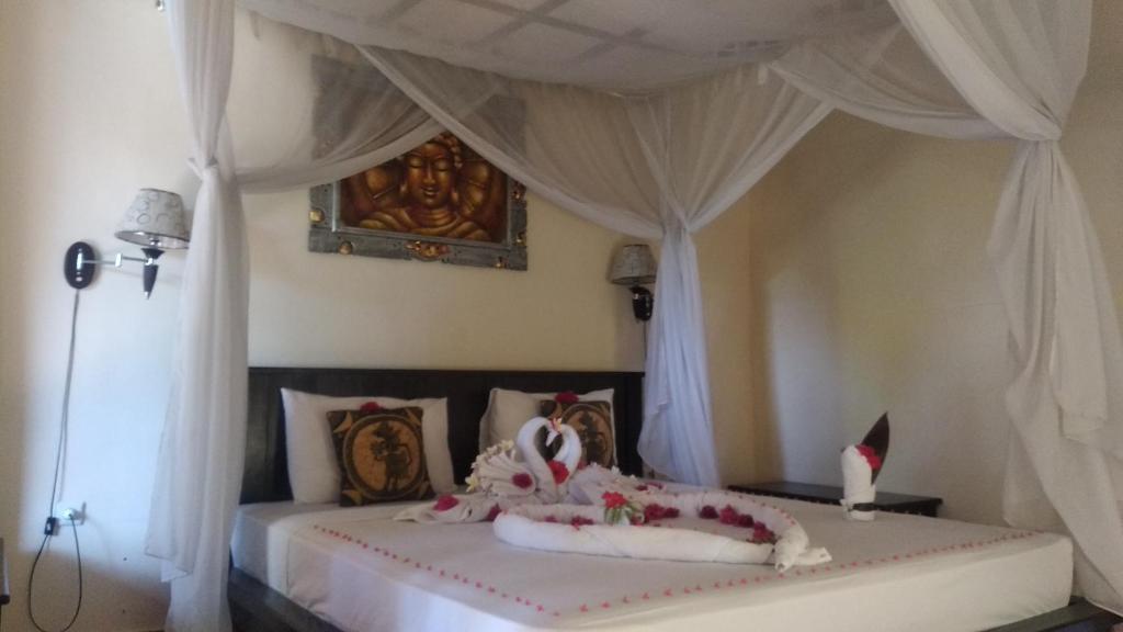 Postel nebo postele na pokoji v ubytování Ode Resto Guesthouse