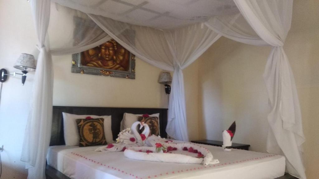 Postel nebo postele na pokoji v ubytování Ode Resto Guesthouse