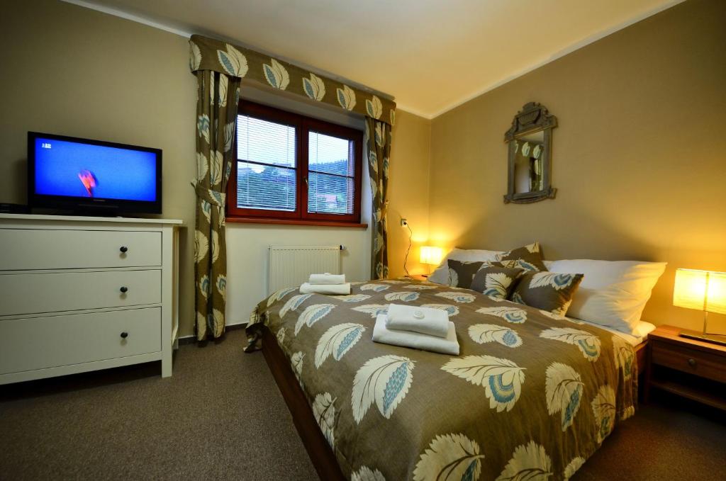 Postel nebo postele na pokoji v ubytování Hotel Stoh