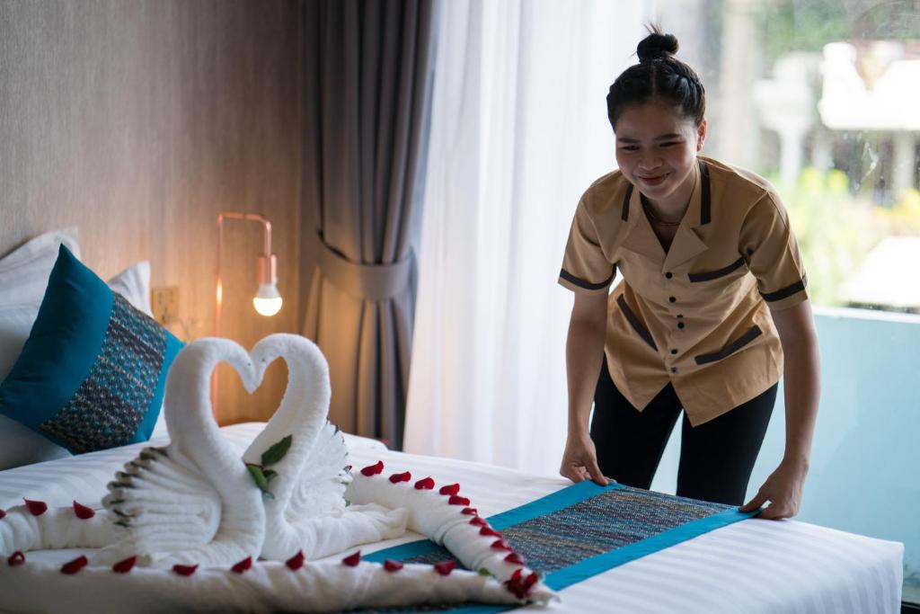 Postel nebo postele na pokoji v ubytování Orussey One Boutique