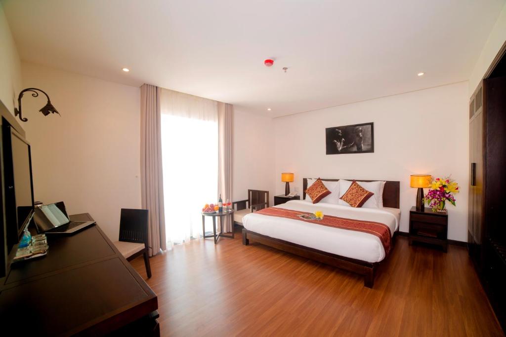 Postel nebo postele na pokoji v ubytování Edele Hotel Nha Trang Beach
