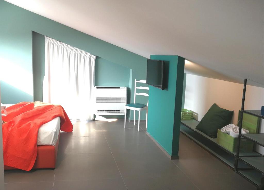 Televízia a/alebo spoločenská miestnosť v ubytovaní Villa Arillà con piscina e padel